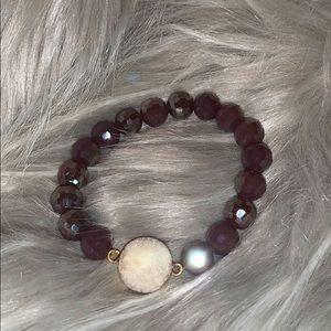 Purple beaded bracelet with white natural stone
